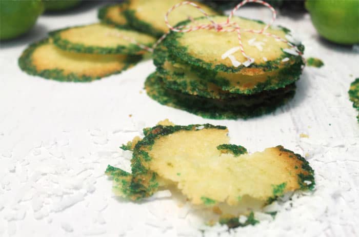 Cookie crisps on white table with green sugar around edge.