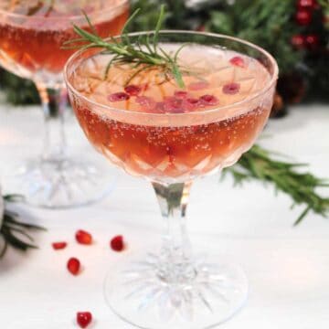 One pomegranate cocktail showing champagne bubbles.