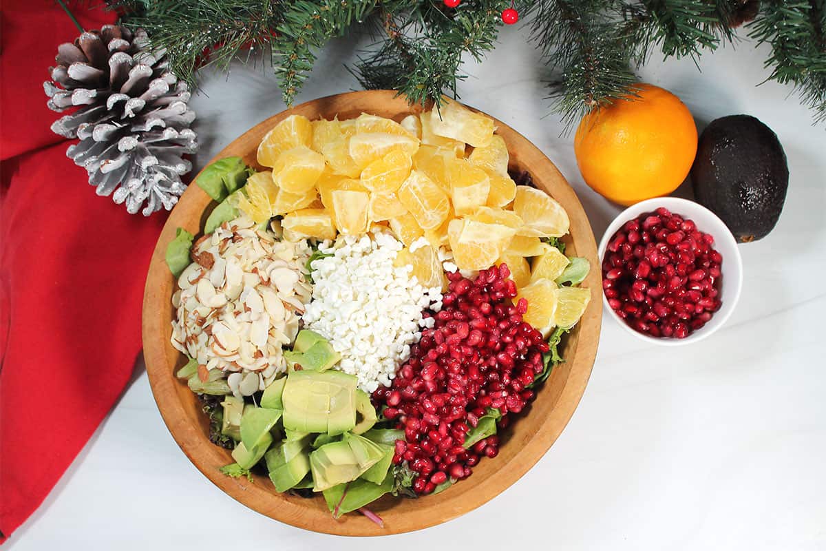 Ingredients in bowl for Christmas Pomegranate Salad.