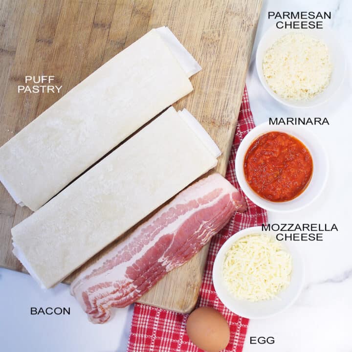 Ingredients for bacon pizza twists on wooden board.