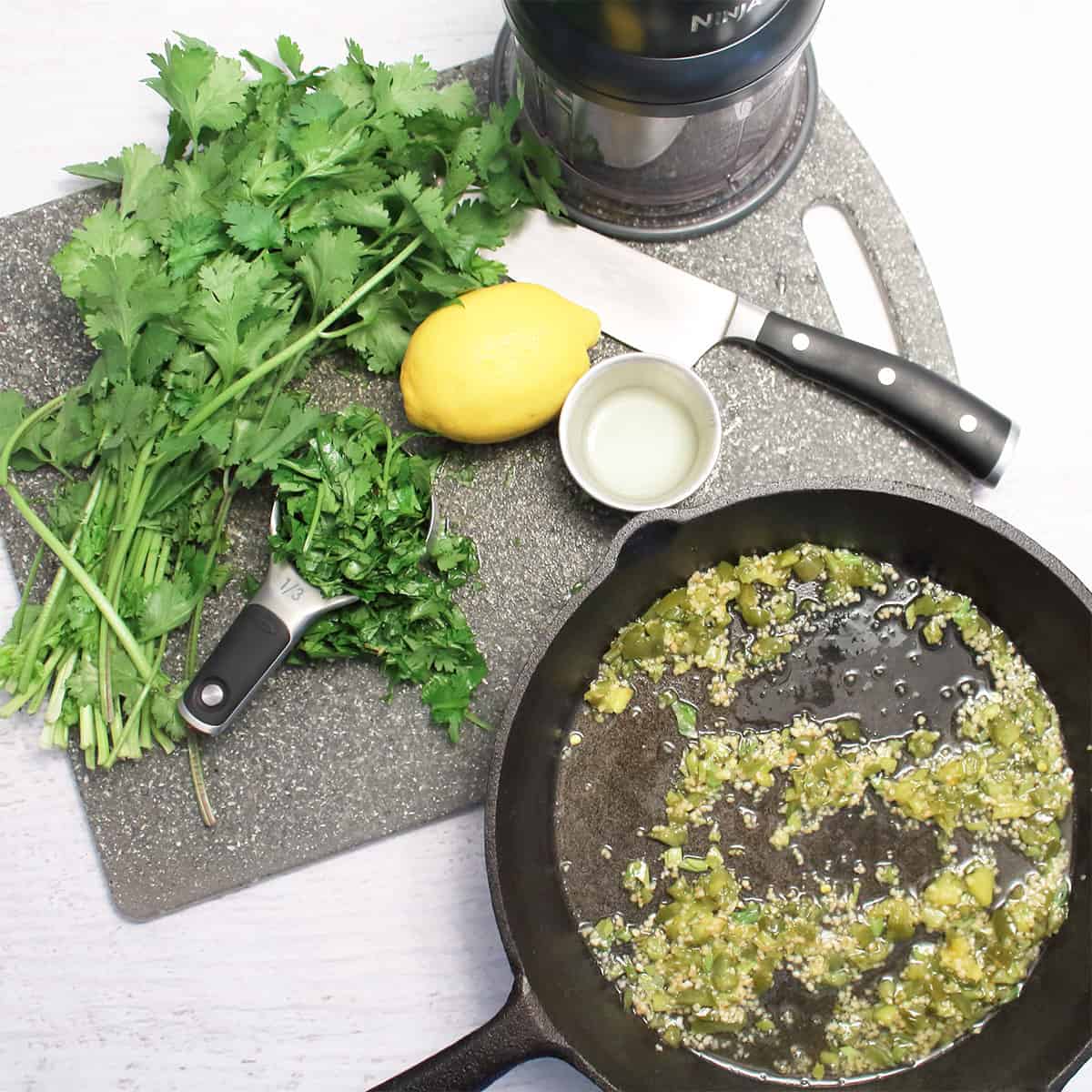 Ingredients for green sauceon white table.