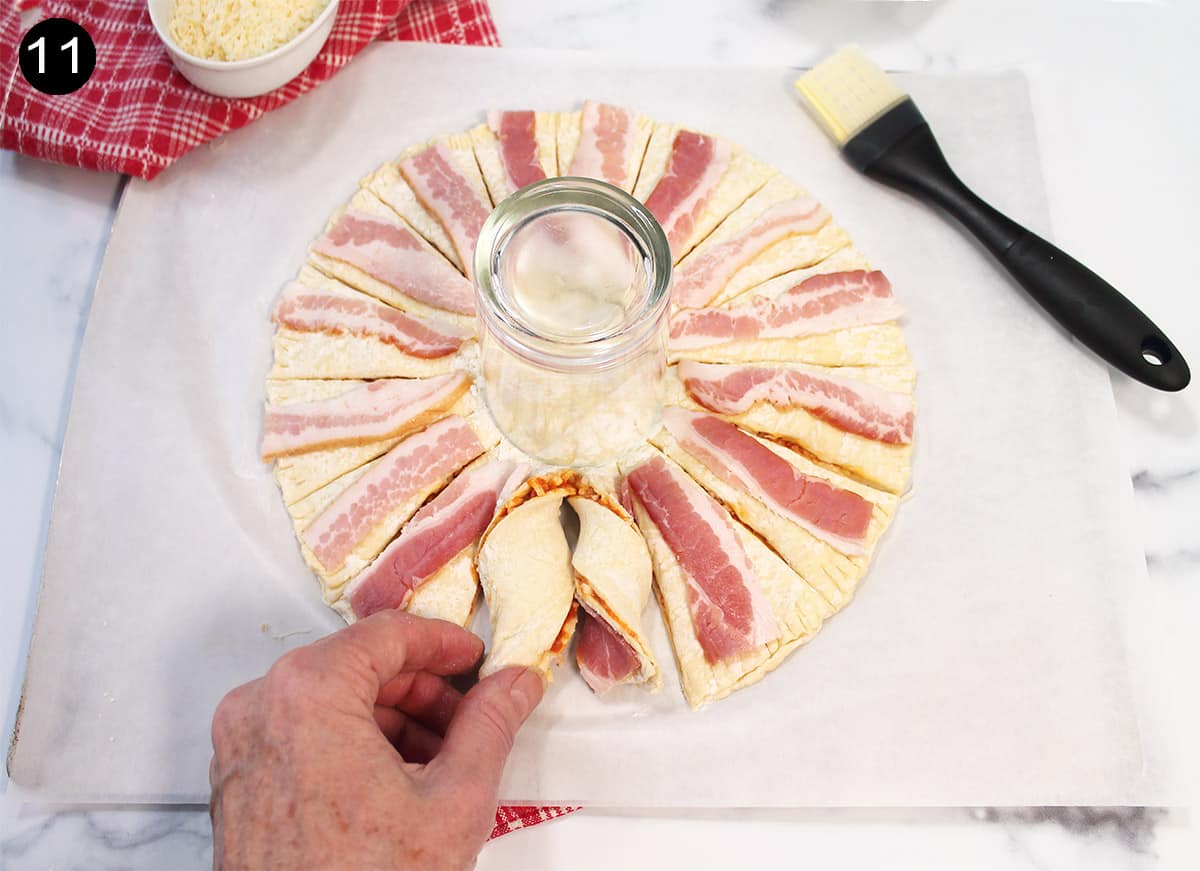 Showing how to twist each pastry wedge.