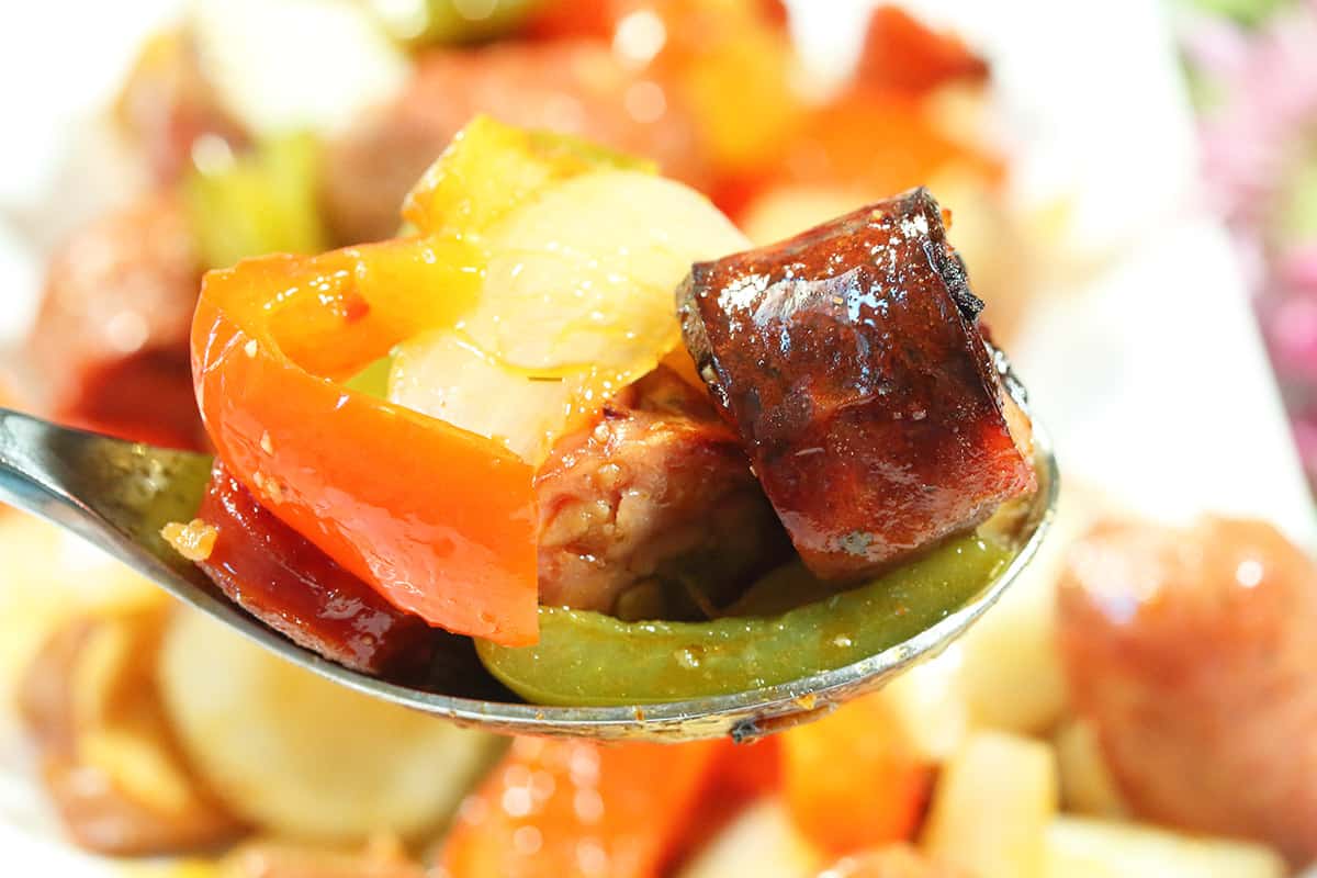 Spoonful of sausage and veggies.