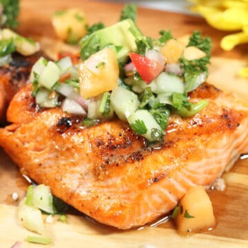 Closeup of grilled salmon with salsa.