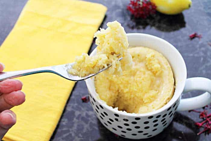 Lemon Mug Cake with a closeup of fork holding bite