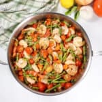 Spaghetti Squash Primavera with shrimp in skillet.