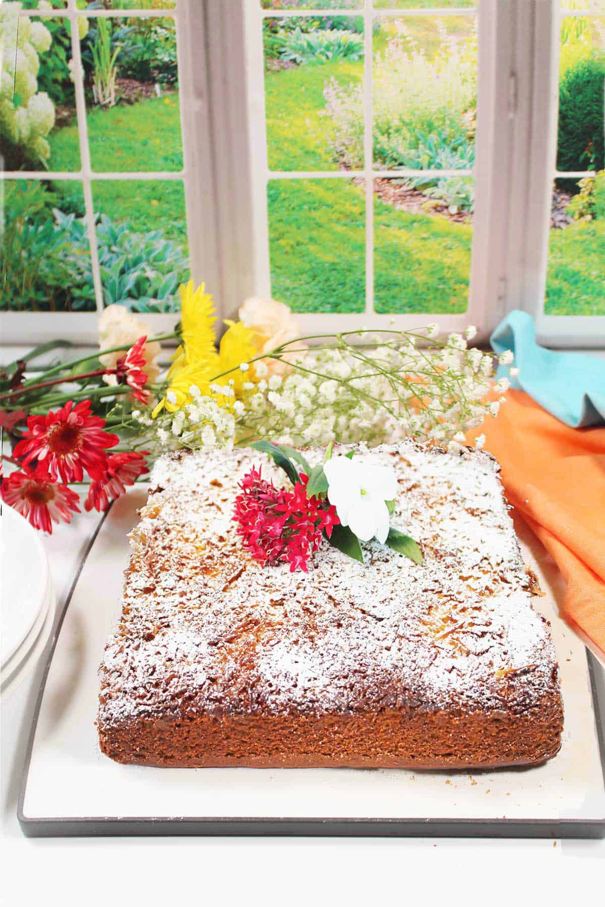 Tomato Soup Cake in front of window.