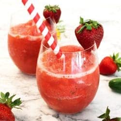 2 Strawberry Mule Slushies showing slushie consistency on white marble table