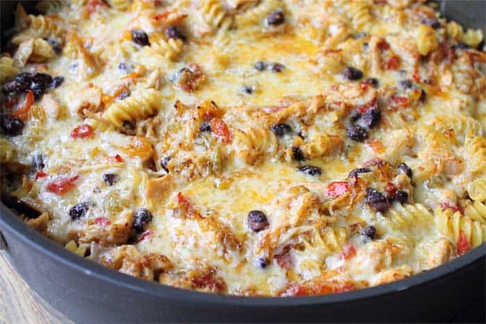 Closeup of broiled cheesy goodness of taco pasta skillet.