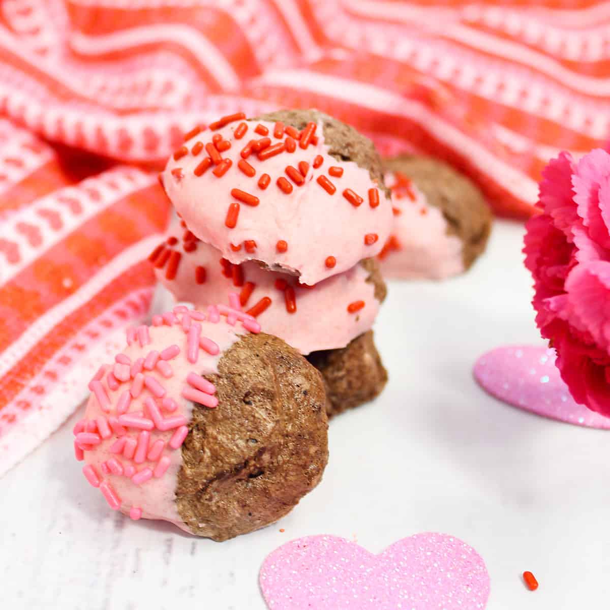 Stack of egg white meringue cookies dipped in chocolate.