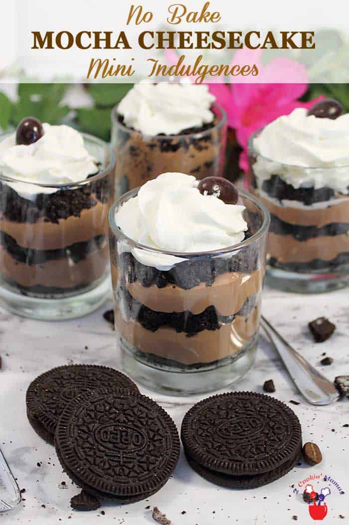 No Bake Mocha Cheesecake Mini Indulgences | 2 Cookin Mamas Don't let the mini size fool you, these No Bake Mocha Cheesecake Mini Indulgences are simply divine! Oreo crumbs are layered with mocha cheesecake then topped with whipped cream and an espresso bean to give you a gourmet dessert that only takes 20 minutes to pull together. Small but decadent, they make the perfect ending for any meal. #dessert #cheesecake #nobakedessert #nobakecheesecake #dessertrecipe