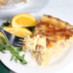 Bite of Ham and Cheese Quiche on fork.