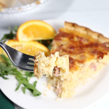 Bite of Ham and Cheese Quiche on fork.