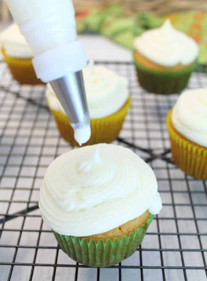 Easy Tequila Lime Cupcakes with Margarita Frosting piping frosting | 2 Cookin Mamas