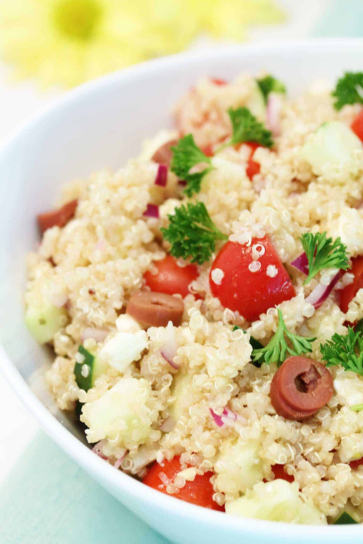 Partial view of Quinoa Salad with feta in bowl.