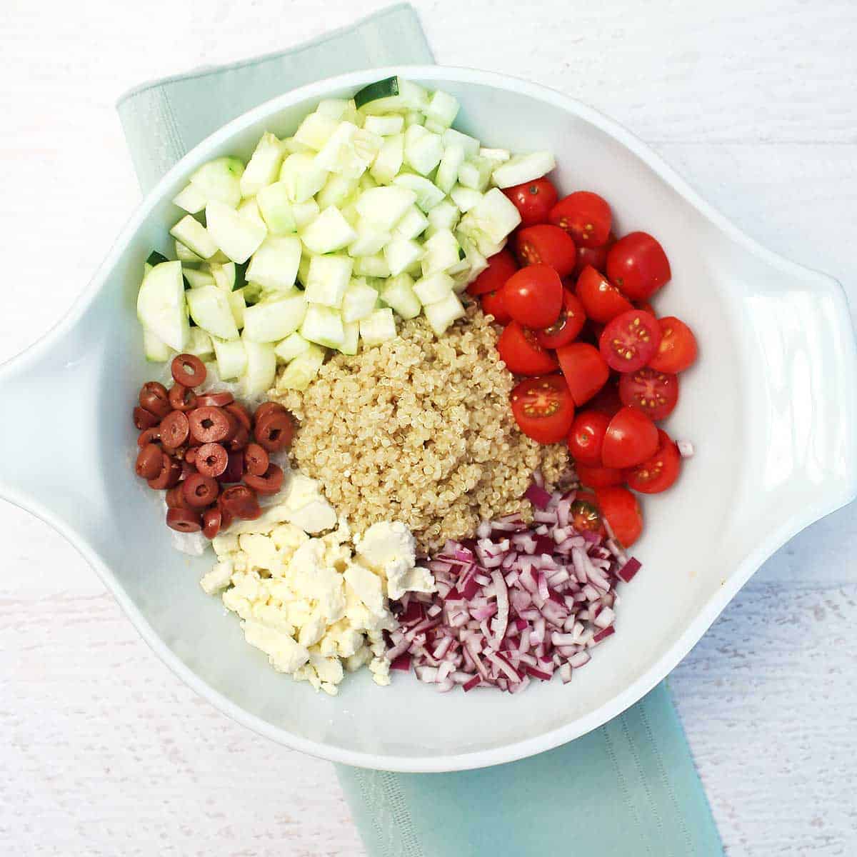 All salad ingredients in a large bowl.