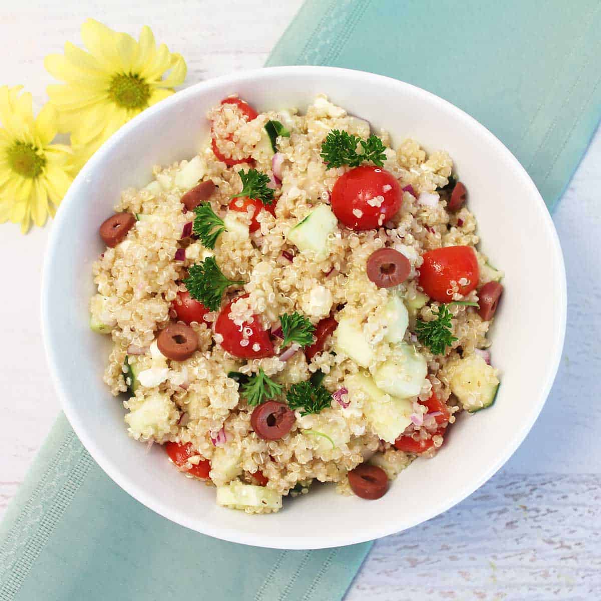 Overhead of Mediterranean salad in white serving bowl.