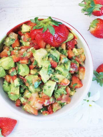 Overhead of Strawberry salsa with avocados in bowl.