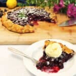 Blueberry Galette slice with galette in back.