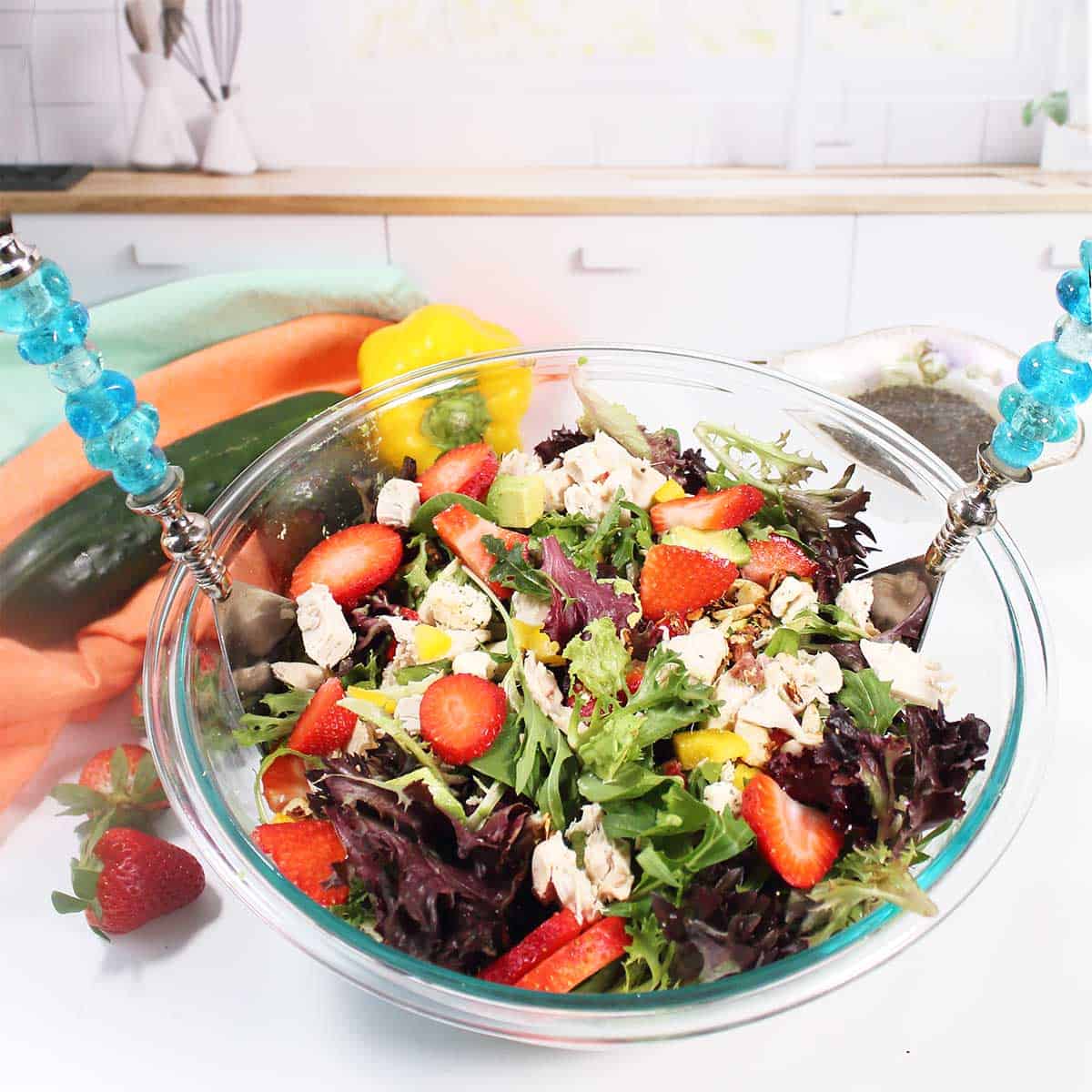 Tossed salad with salad spoon and fork.