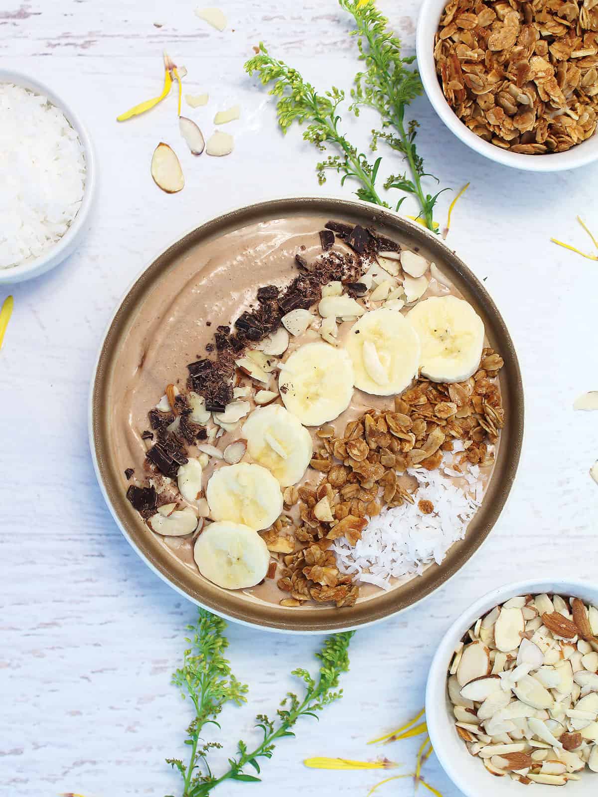 Chocolate Caramel Smoothie Bowl in bowl with toppings.