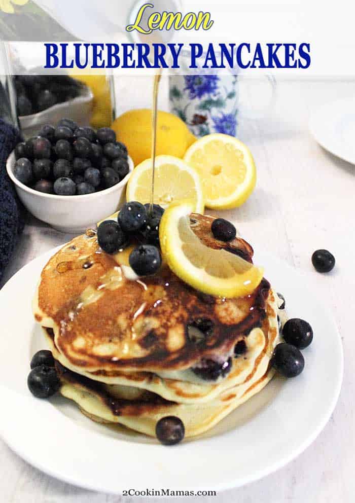 Lemon Blueberry Pancakes pin | 2 Cookin Mamas These light and fluffy Lemon Blueberry Pancakes bring the fresh flavors of summer to your table. Sweet blueberries are nestled into soft, flavorful lemon pancakes that will make breakfast the best meal of your day! #pancakes #blueberry #lemon #breakfast #recipe #fluffy #homemade