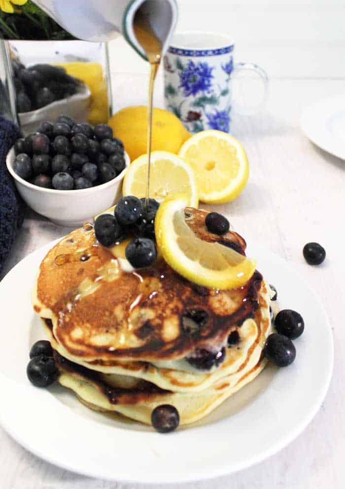 Lemon Blueberry Pancakes pouring syrup