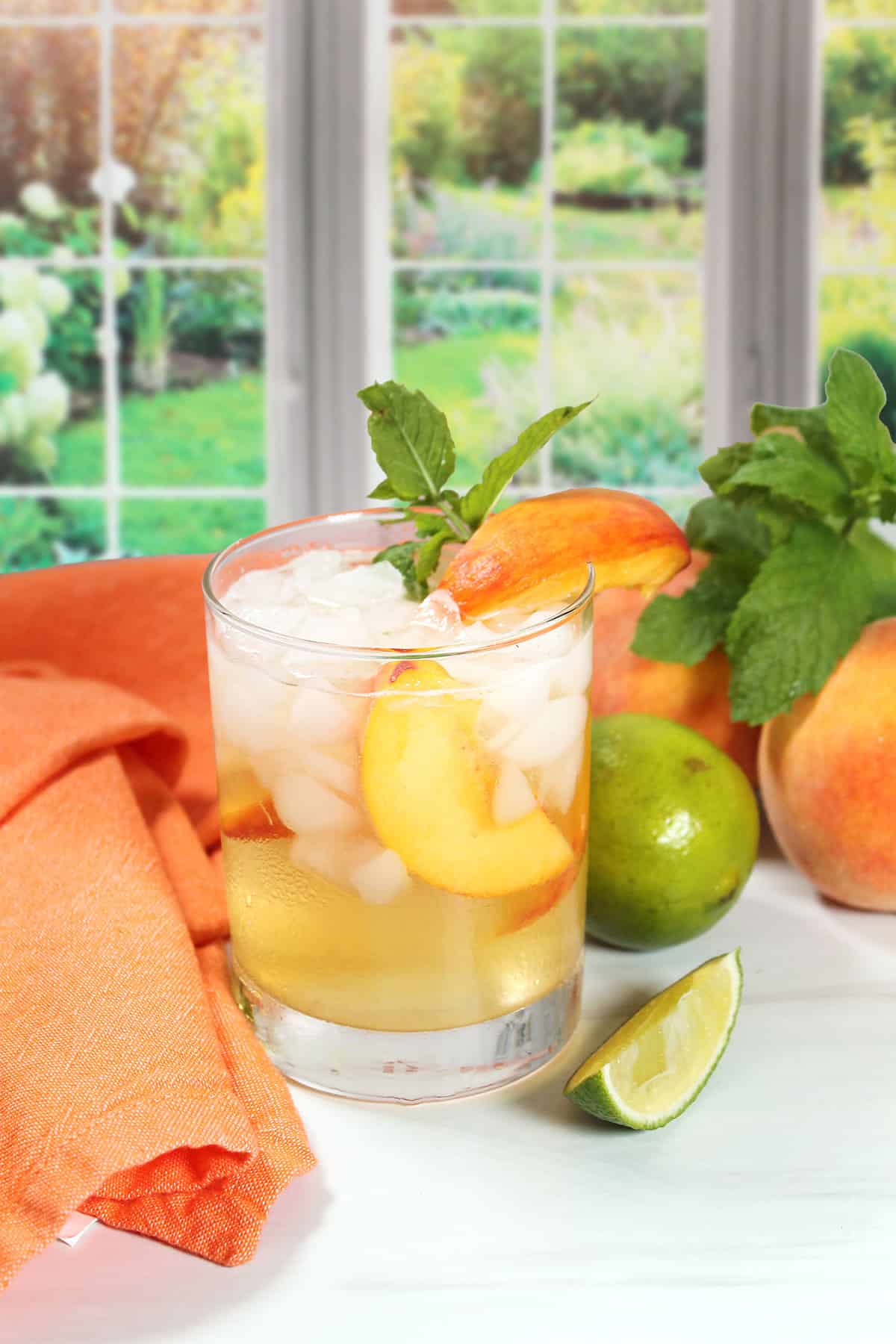Sparkling Peach Mint Julep with garnish of peach and mint.