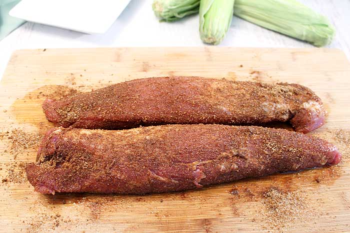 Spice mix has been rubbed into pork.