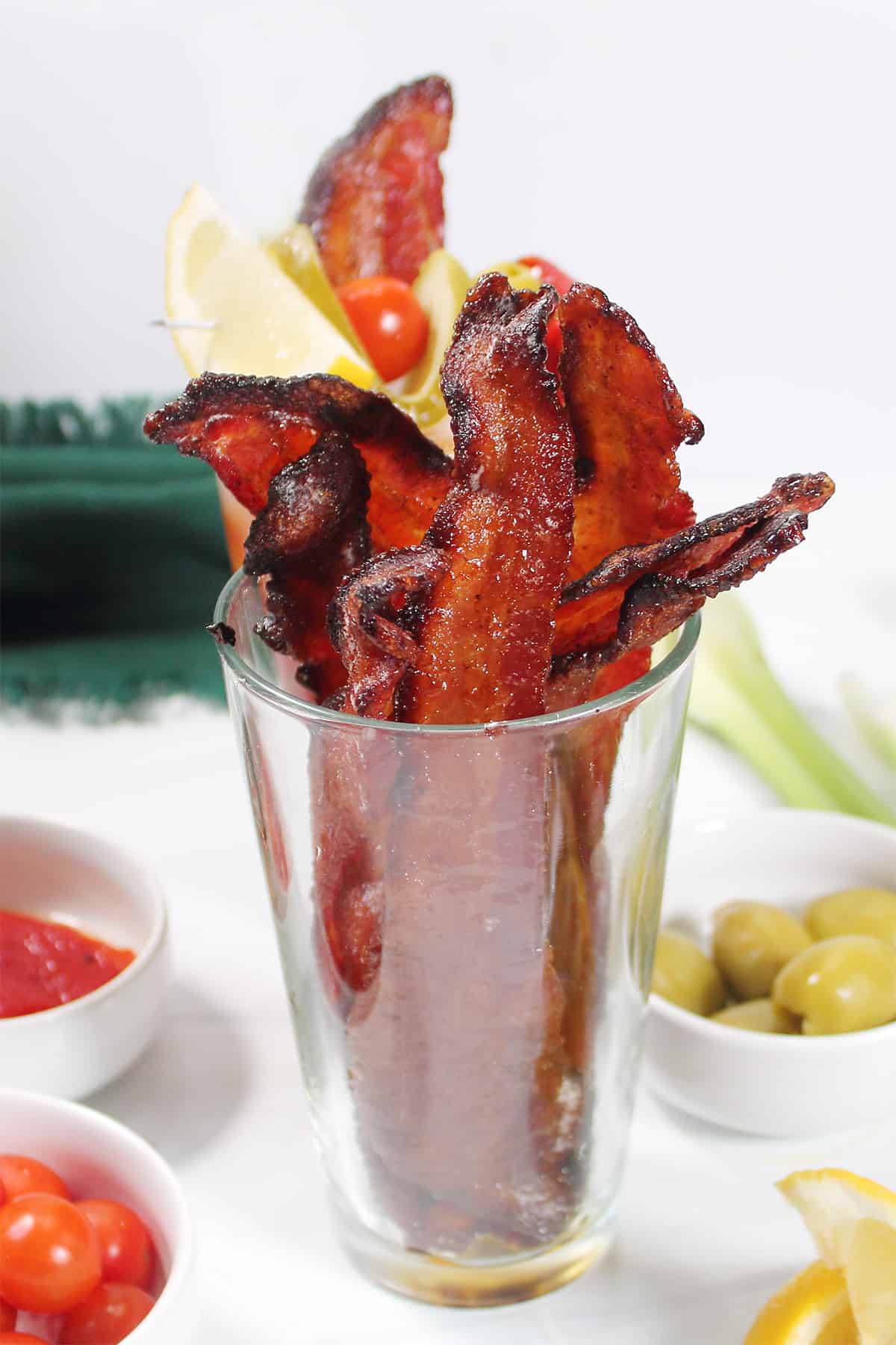 Candied bacon in a glass.