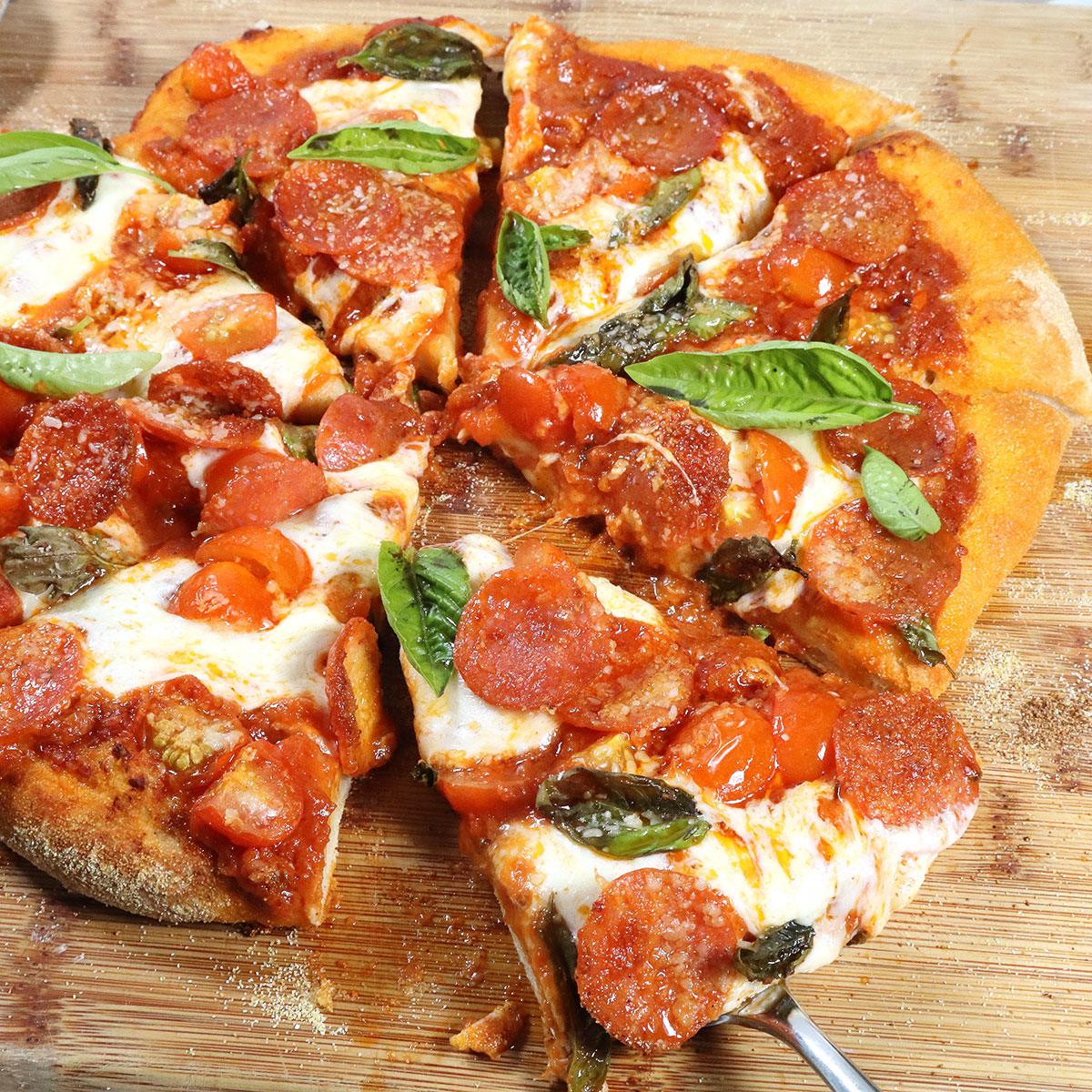 Closeup of homemade pepperoni pizza slice.