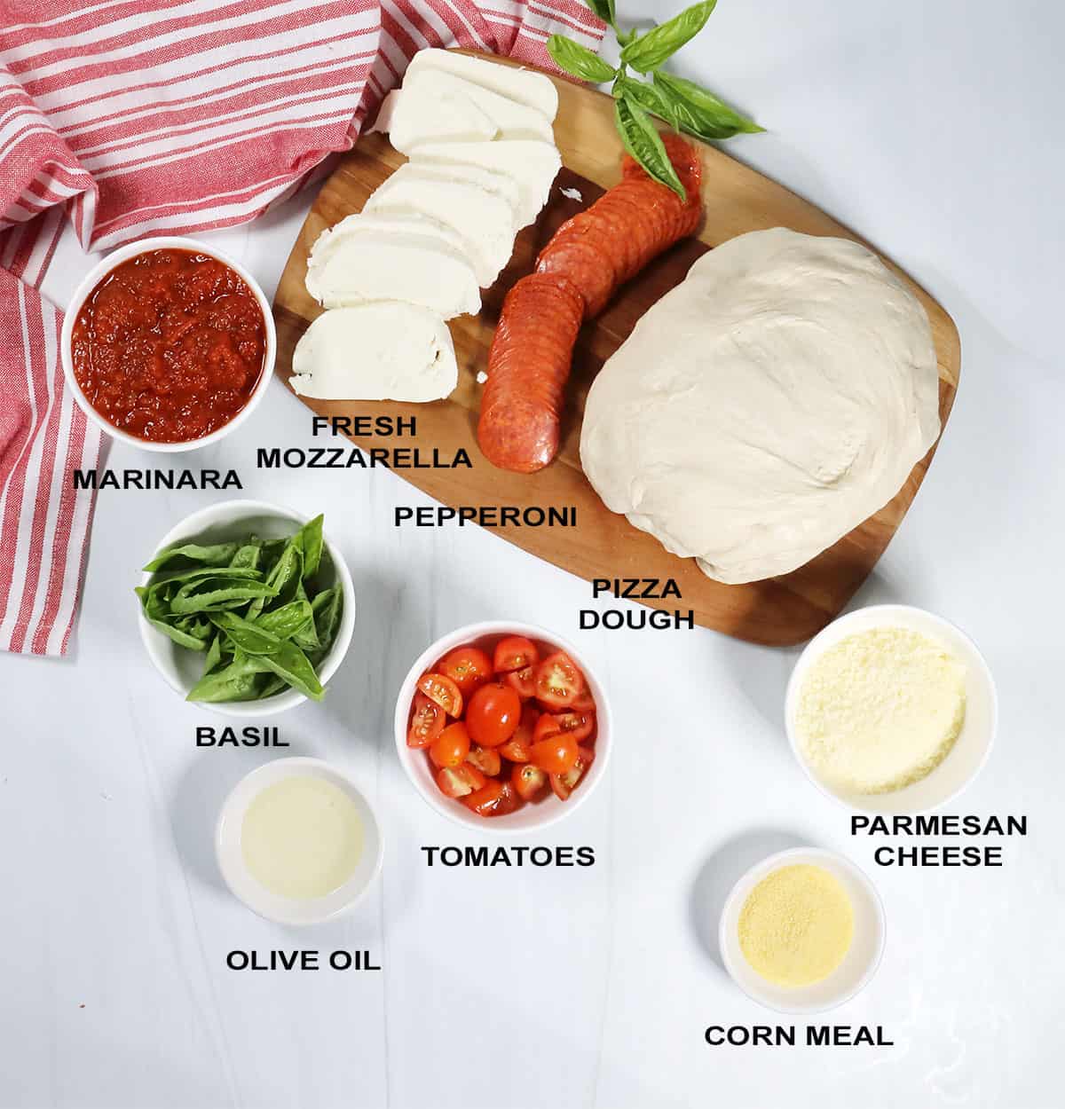 Ingredients for homemade pepperoni pizza recipe.