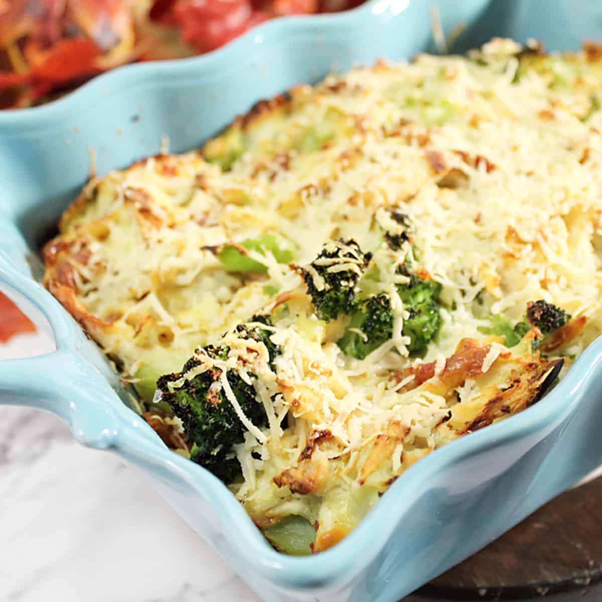 Closeup of baked casserole on white table.