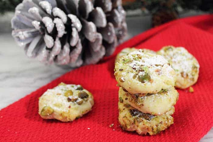 Pistachio Whipped Shortbread Cookies stacked wide