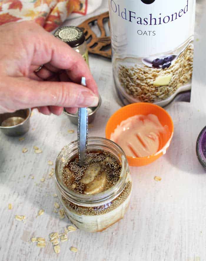 Pumpkin Pie Overnight Oats mixing in mason jar