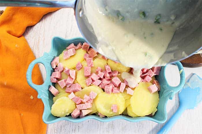 Cheesy Scalloped Potatoes and Ham finishing with cream