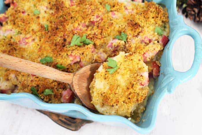 Cheesy Scalloped Potatoes and Ham spoon in dish