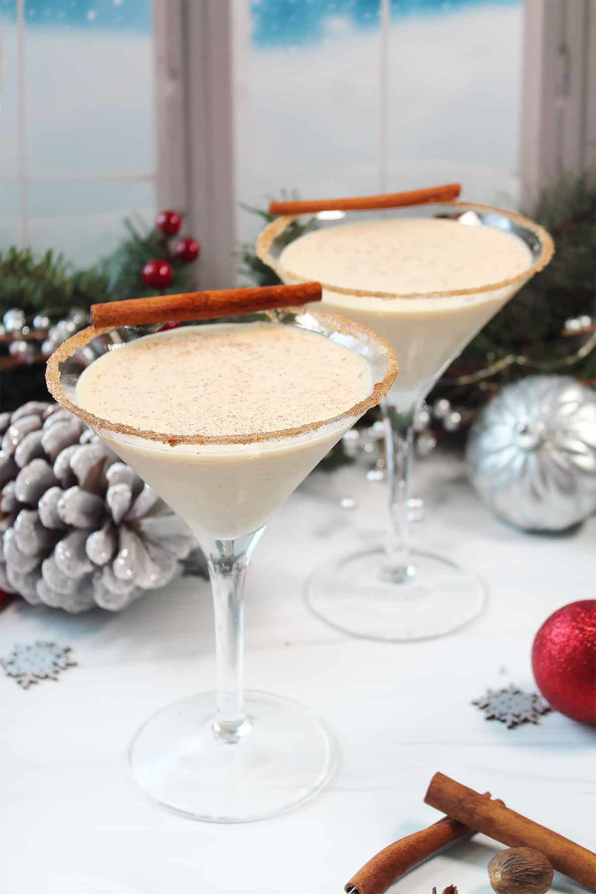 https://2cookinmamas.com/wp-content/uploads/2018/12/Eggnog-Martini-two-cocktails-with-cinnamon-sugar-rim.jpg