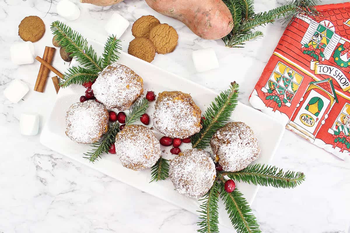 Overhead of plated sweet potato balls with gingersnaps and bright pot holder beside them.