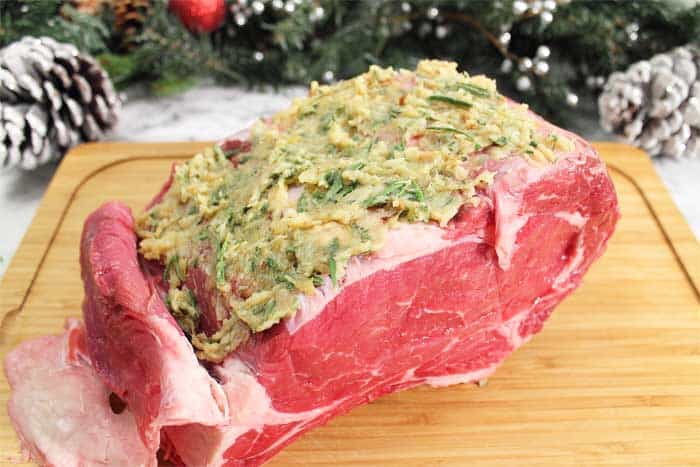 How to Cook the Perfect Standing Rib Roast cut fat back and apply garlic herb paste