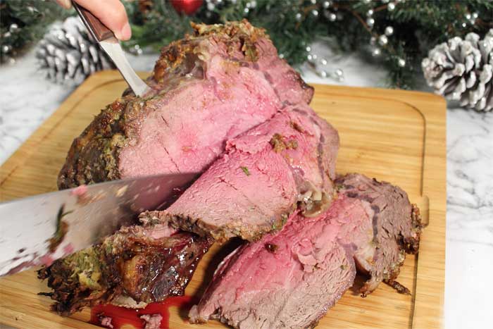 How to Cook the Perfect Standing Rib Roast slicing meat