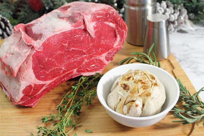 How to Cook the Perfect Standing Rib Roast with roasted garlic and herbs