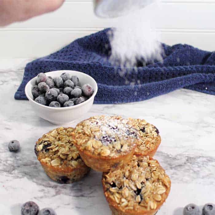 Blueberry Yogurt Oatmeal Muffins sprinkle with powdered sugar