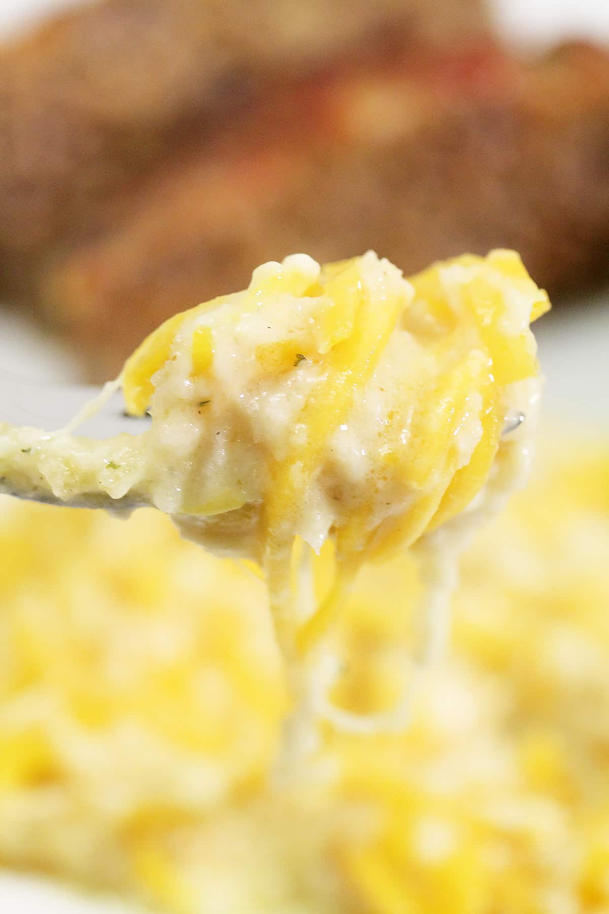 Butternut Squash Mac and Cheese forkful closeup.