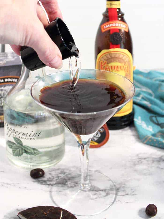 Adding in liqueurs to cocktail