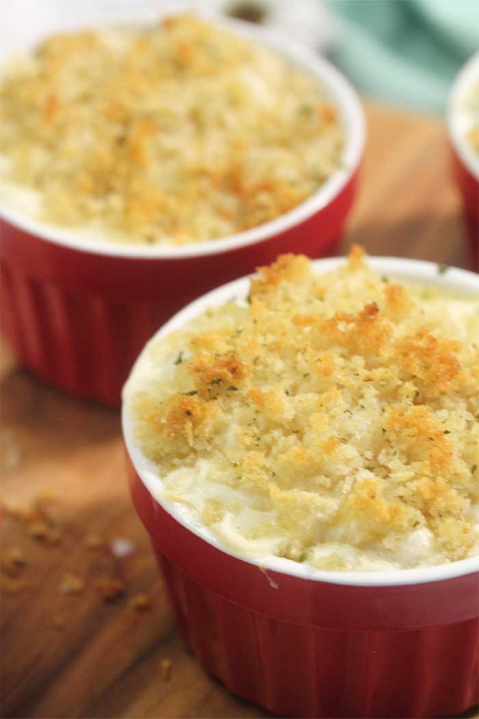 closeup of baked browned mac and cheese in ramekin 