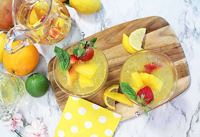 Mango cocktail overhead of 2 cocktail with pitcher