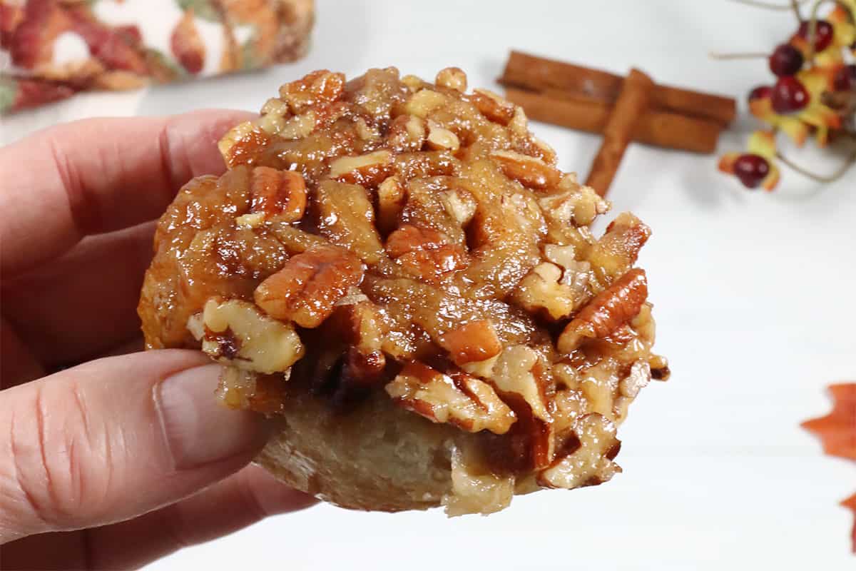 Showing caramel topping on sticky bun.