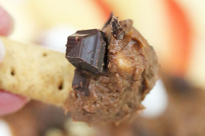 Scoop of chocolate cookie dough on graham cracker dipper.