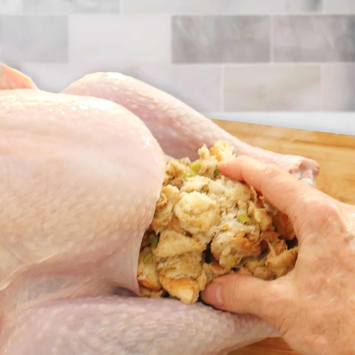 Stuffing the turkey.